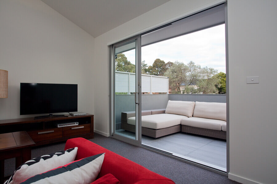 Kew-House---Upstairs-living-space-with-balcony-slider