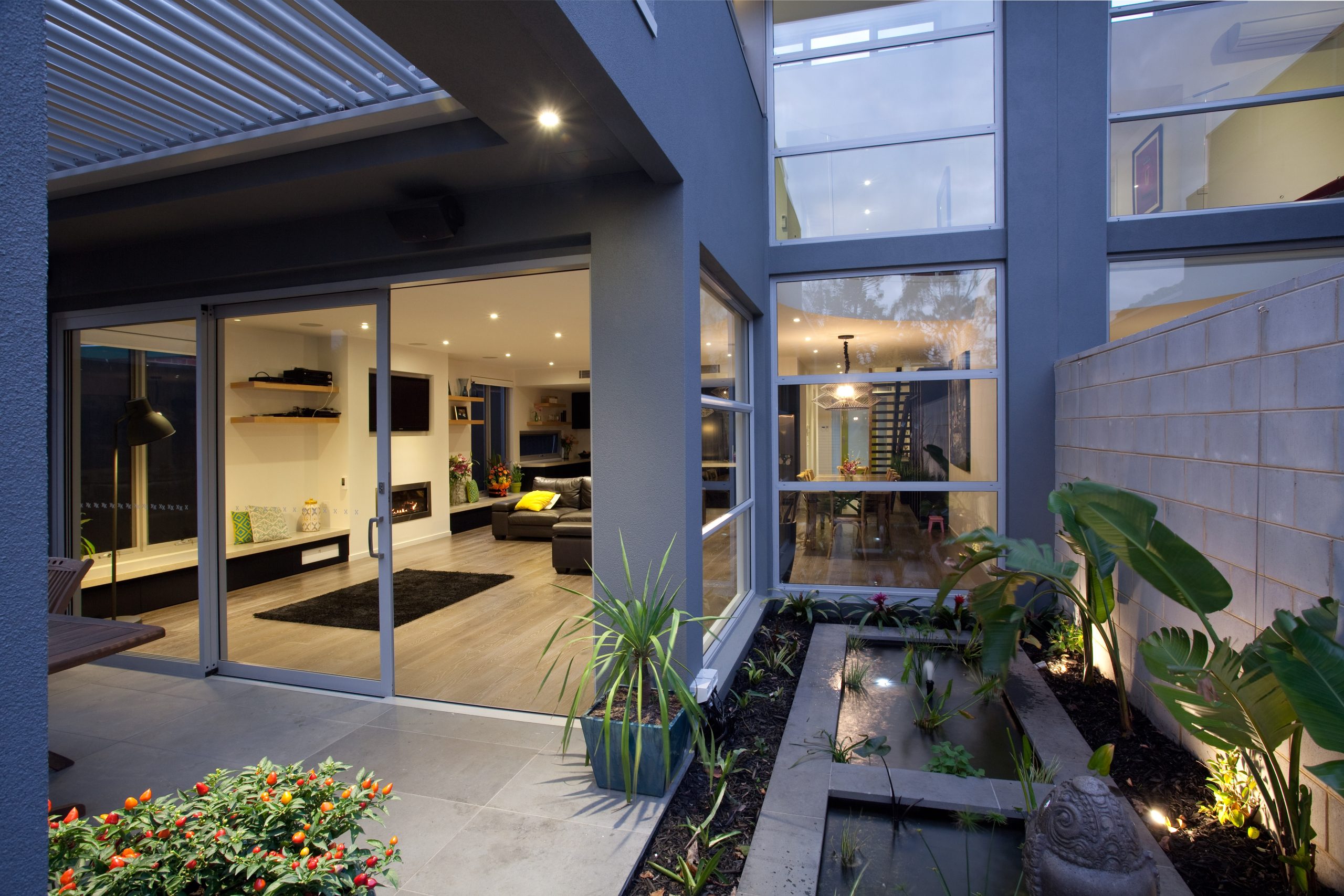 How to Choose the Right Tracks for an Aluminium Sliding Door Kew House Backyard water feature scaled